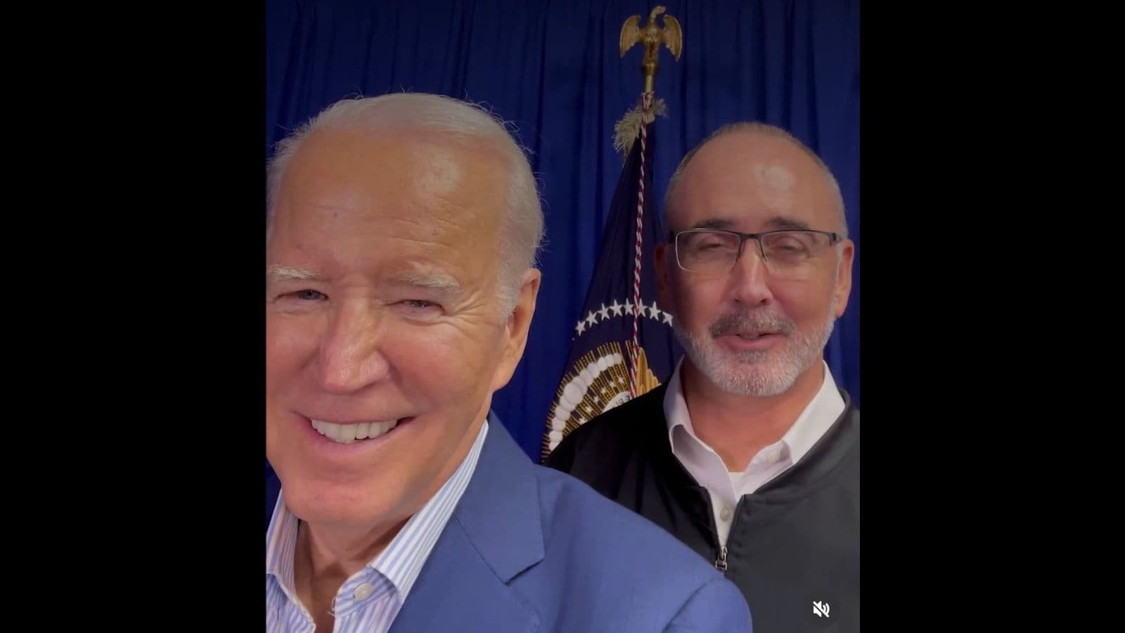 UAW President Shawn Fain and Joe Biden share a platform in Belvidere, Illiniois, November 9, 2023