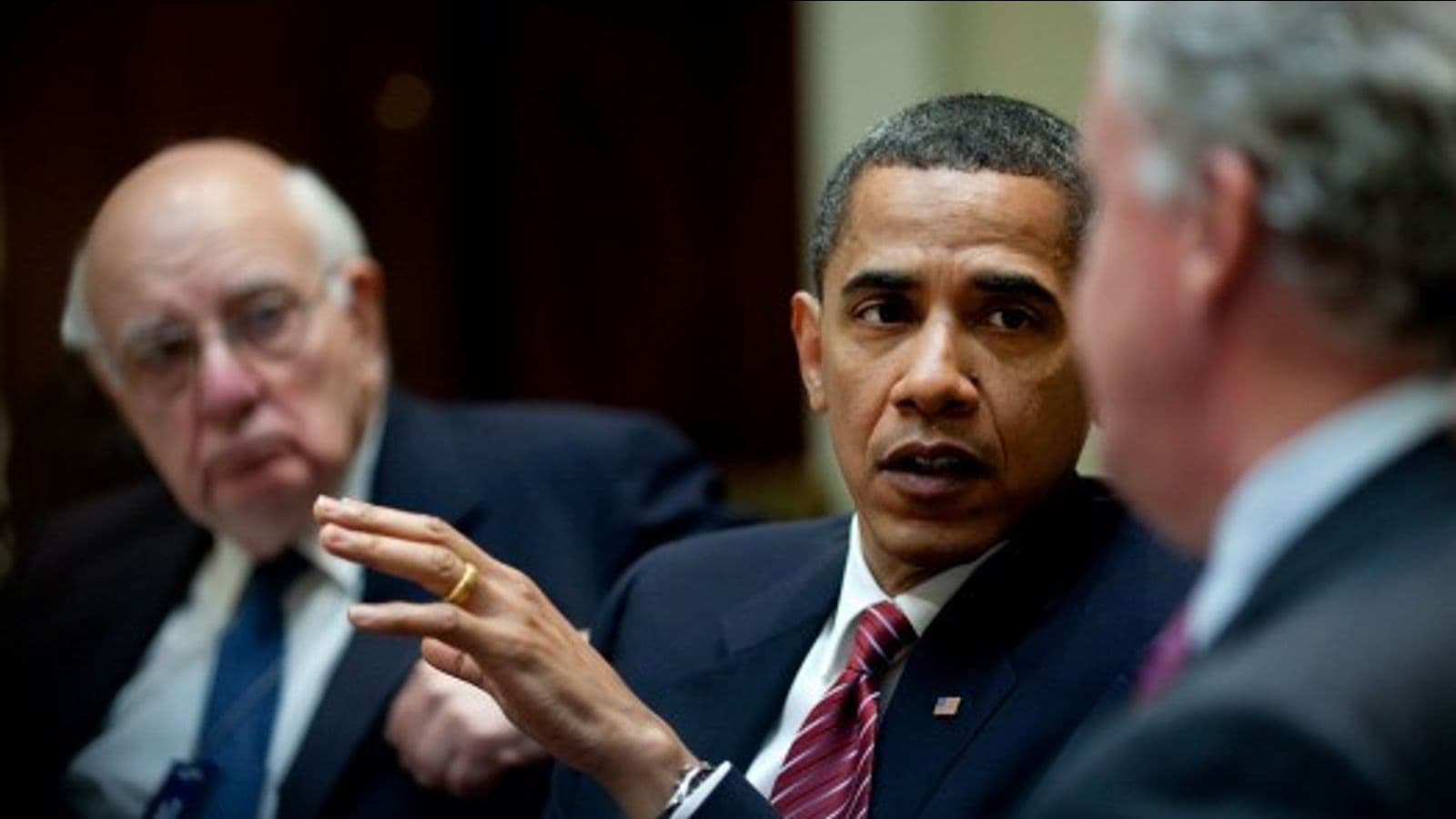 President Barack Obamaa, flanked by Paul Volcker, left, and General Electric Chief Executive Officer Jeffrey Immelt, right, comments during the Economic Recovery Advisory Board meeting in the Roosevelt Room of the White House.