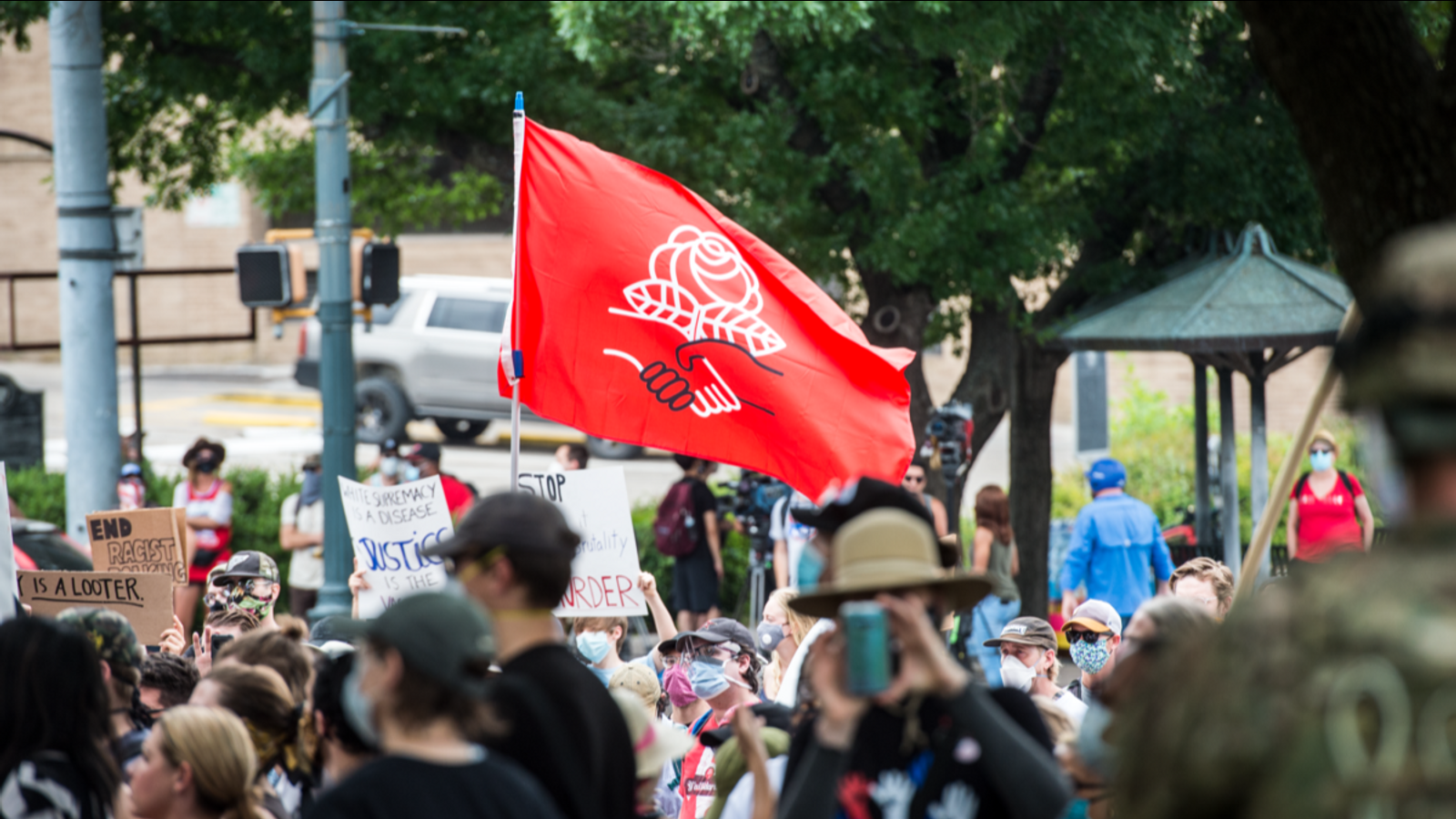 Democratic Socialists of America flag at an anti-police violence protest in Austin, Texas, May 2020.